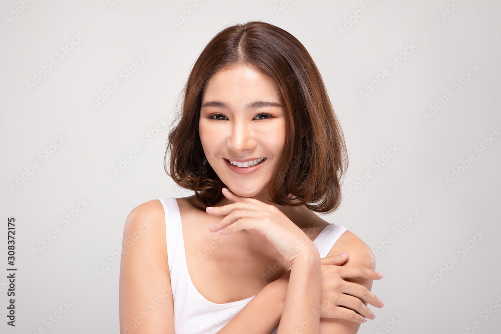 Beautiful Young Asian Woman with short hair Looking While Touching Chin feeling so happy and cheerful with healthy Clean and Fresh skin,isolated on white background,Beauty Cosmetics Concept Beautiful Young Asian Woman with short hair Looking While Touching Chin feeling so happy and cheerful with healthy Clean and Fresh skin,isolated on white background,Beauty Cosmetics Concept