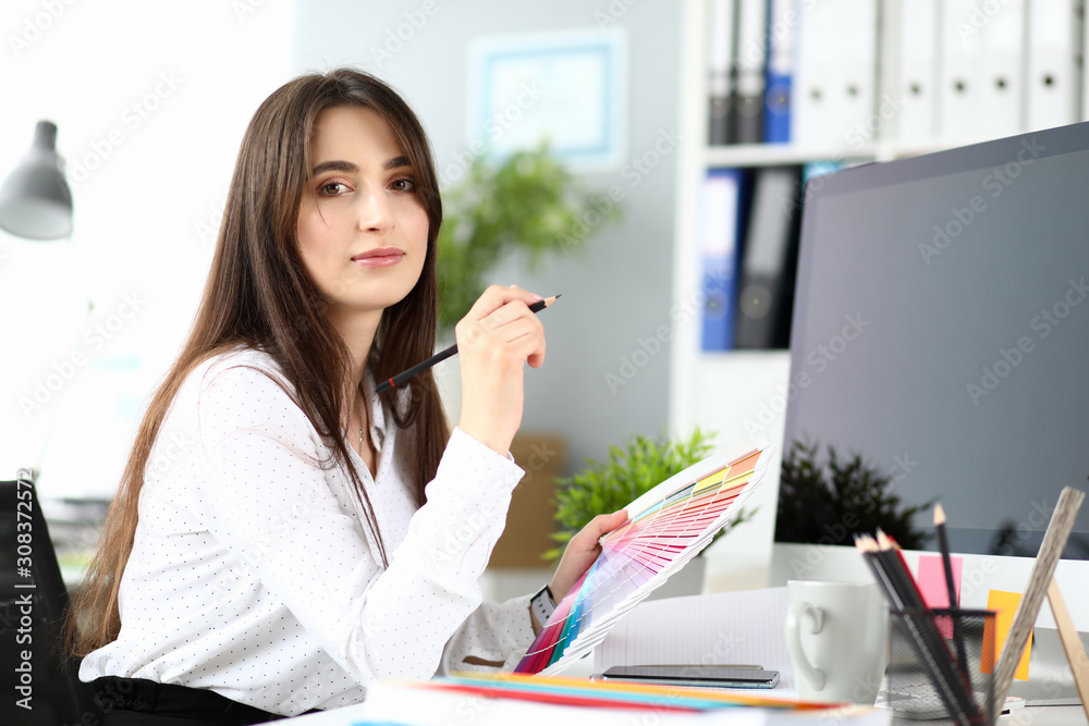 Designer choosing colorful scheme Designer choosing colorful scheme