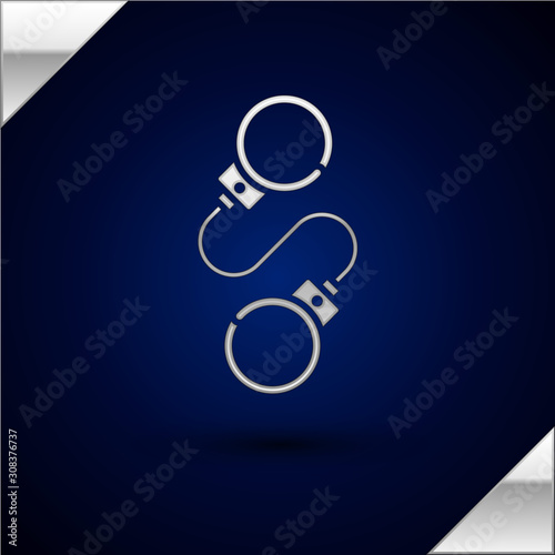 Silver Handcuffs icon isolated on dark blue background. Vector Illustration