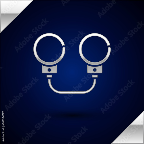 Silver Handcuffs icon isolated on dark blue background. Vector Illustration