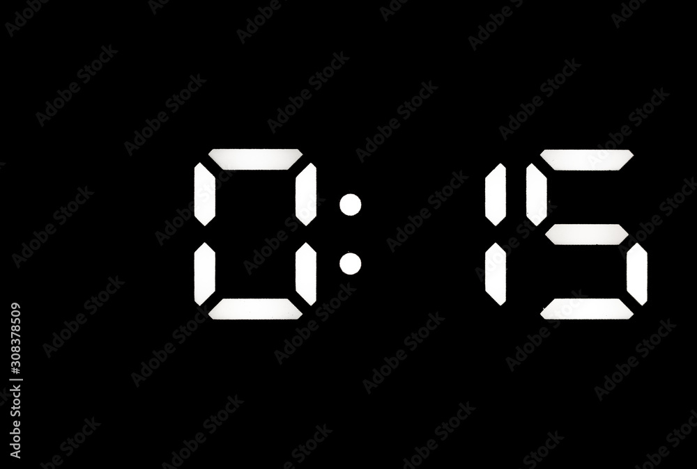 Real white led digital clock on black background