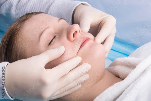 facial massage, spa skin care in a beauty salon