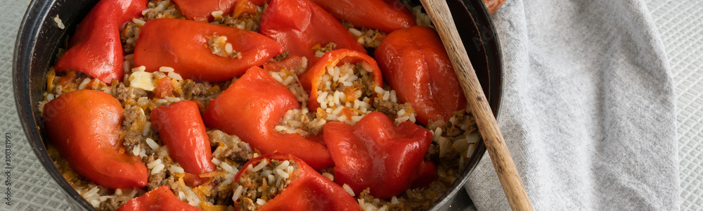 Ready for eat stuffed red peppers with minced meat, rice and vegetables