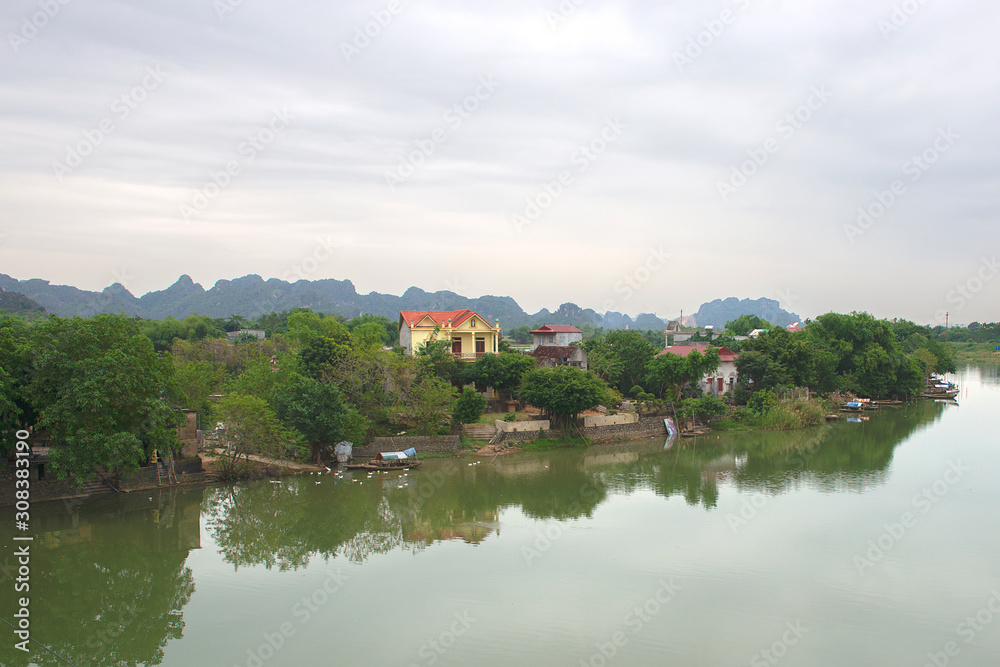 Panoramic view of karst formations in Tam Coc, a part of Trang An Complex , was declared a UNESCO World Heritage Natural and Cultural Monument.Ninh Binh province, Vietnam Panoramic view of karst formations in Tam Coc, a part of Trang An Complex , was declared a UNESCO World Heritage Natural and Cultural Monument.Ninh Binh province, Vietnam