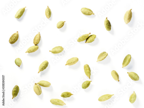 Spice Green Cardamom (Elettaria cardamomum) makes food tastier and healthier. Indian culinary ingredient. Grains isolated on white background