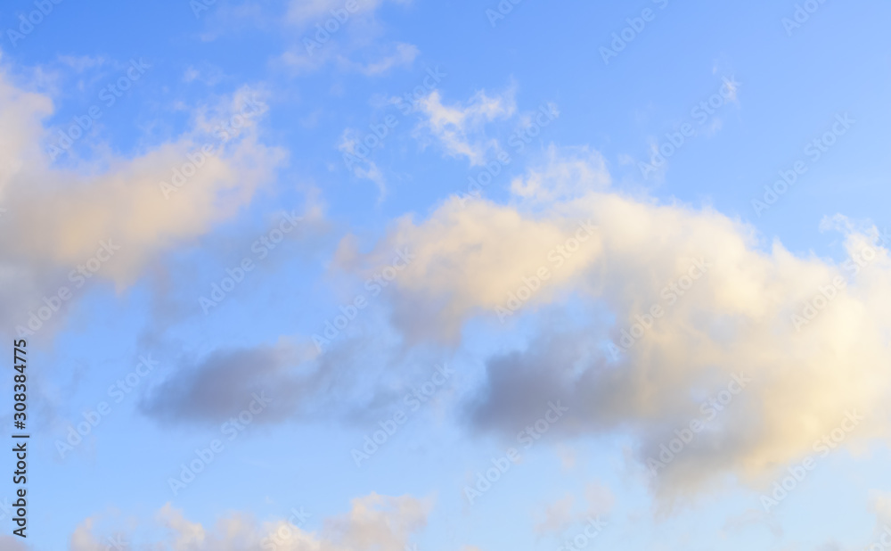 Puffy clouds against blue sky wallpaper background