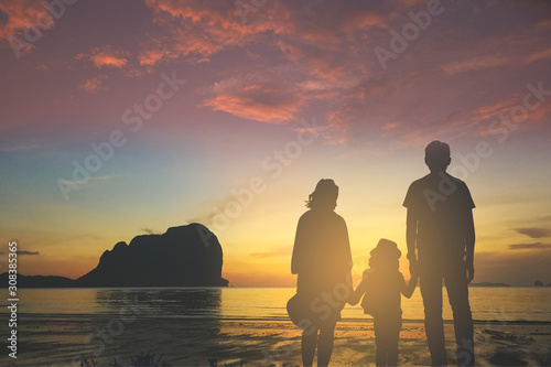 family at sea and sunset