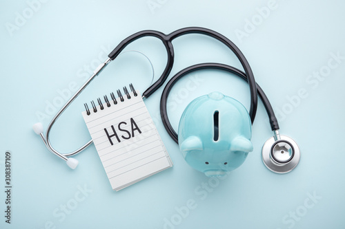 Health saving account, hsa concept on blue background photo