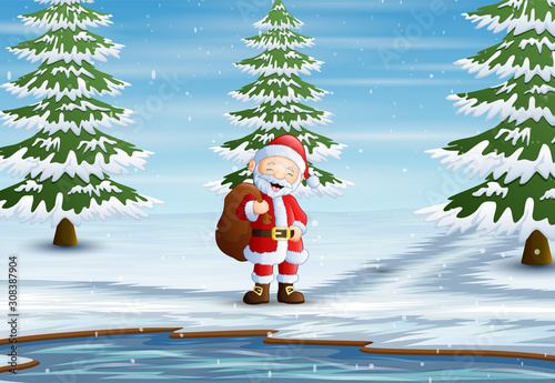 Santa claus standing with sack of presents in forest
