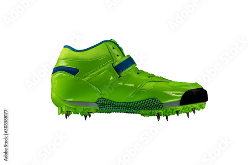 Green glossy sneaker with spikes on a white background. Sport shoes.