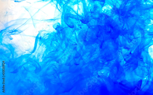 Blue fantastic abstract background. Watercolor ink in water. Cool trending screensaver.