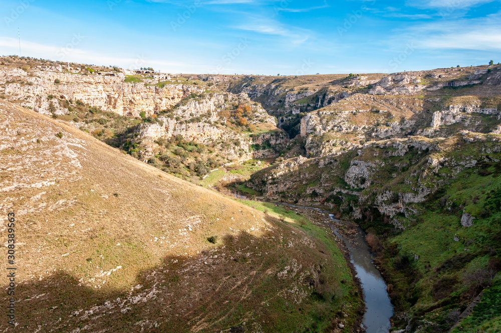 Obraz premium Matera, European Capital of Culture 2019, Italy. The city built on stones, created by sculpting rocks to obtain houses, existing since ancient times. Mountains of the city with rock caves.