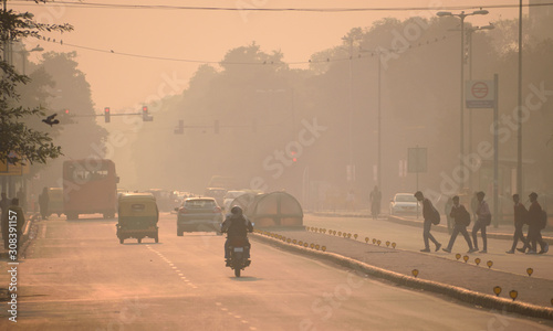 People walking in the streets of Delhi amidst smog photo