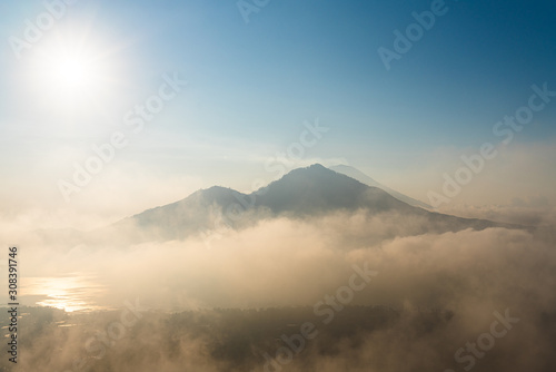 Cloudy sunrise on the volcano Batur in Bali Indonesia