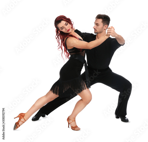 Passionate young couple dancing on white background