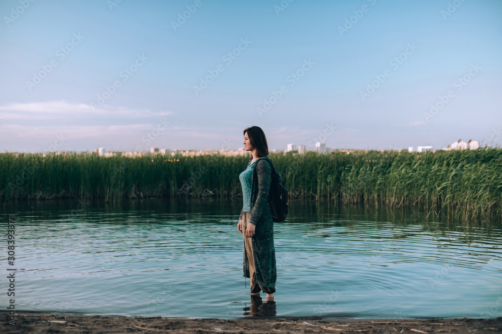 Girl on the lake in the evening