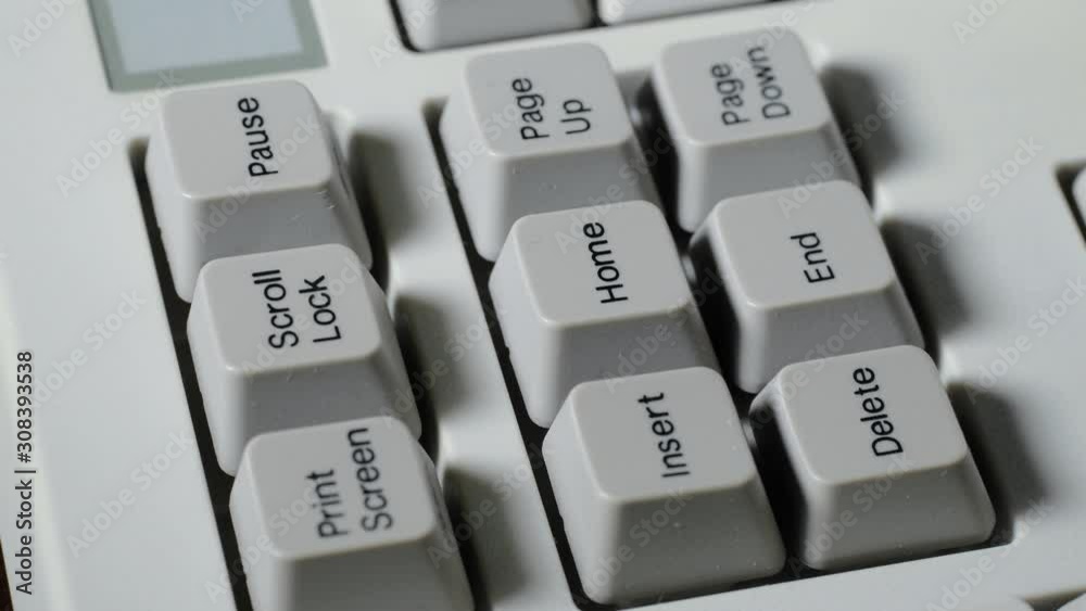 Finger presses HOME button on keyboard