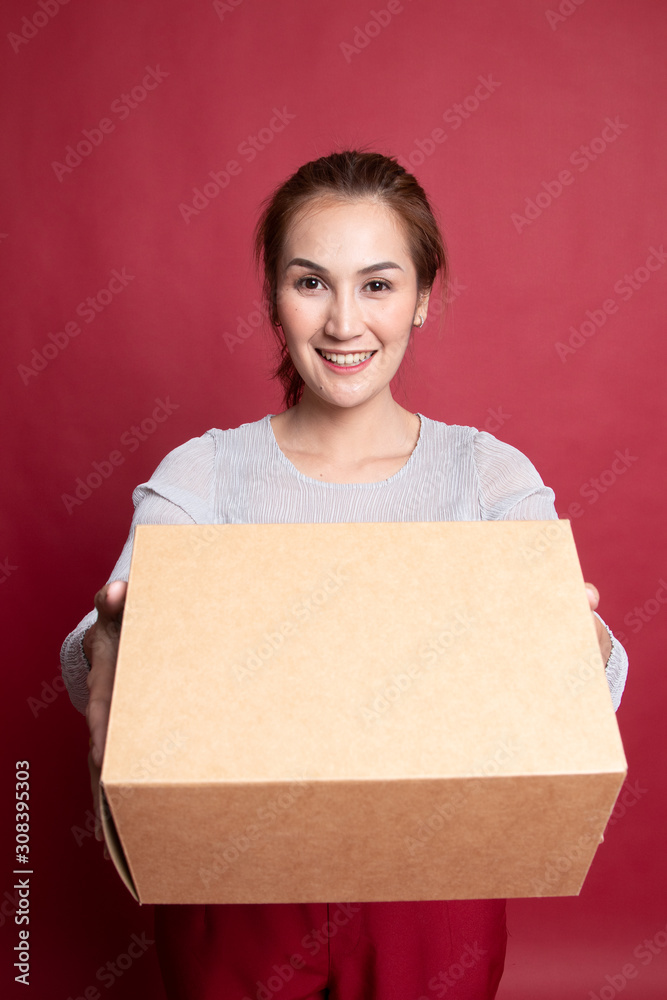 Delivery, relocation and unpacking. young asian woman holding cardboard box. Delivery, relocation and unpacking. young asian woman holding cardboard box.