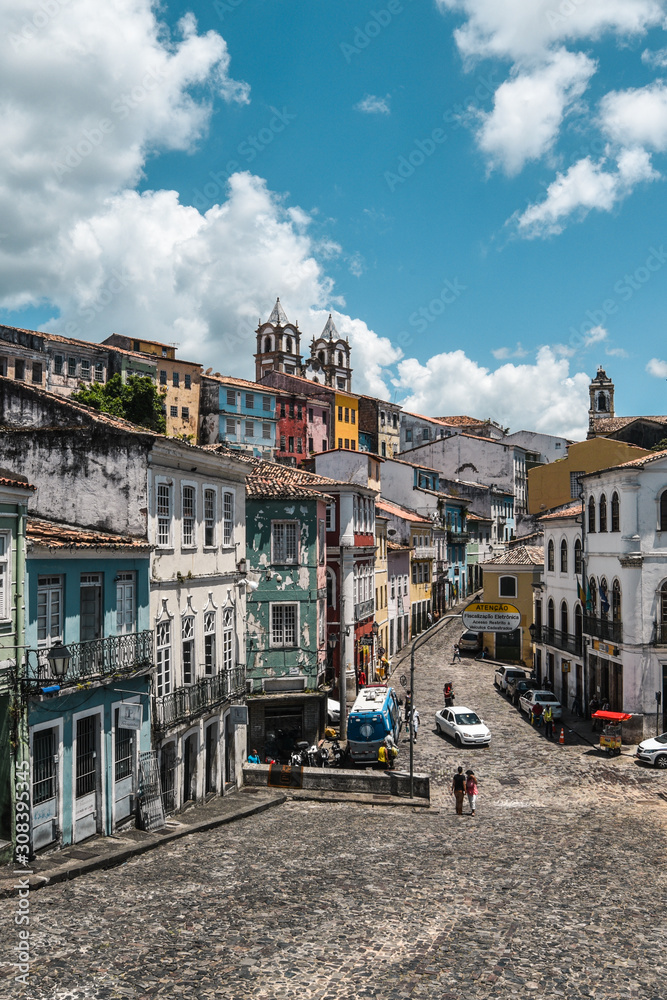 Fototapeta premium Salvador, Bahia / Brasil - 11/14/2019: Cityscape of old part of Salvador Bahia with colorful houses and beautiful clouds and blue sky 