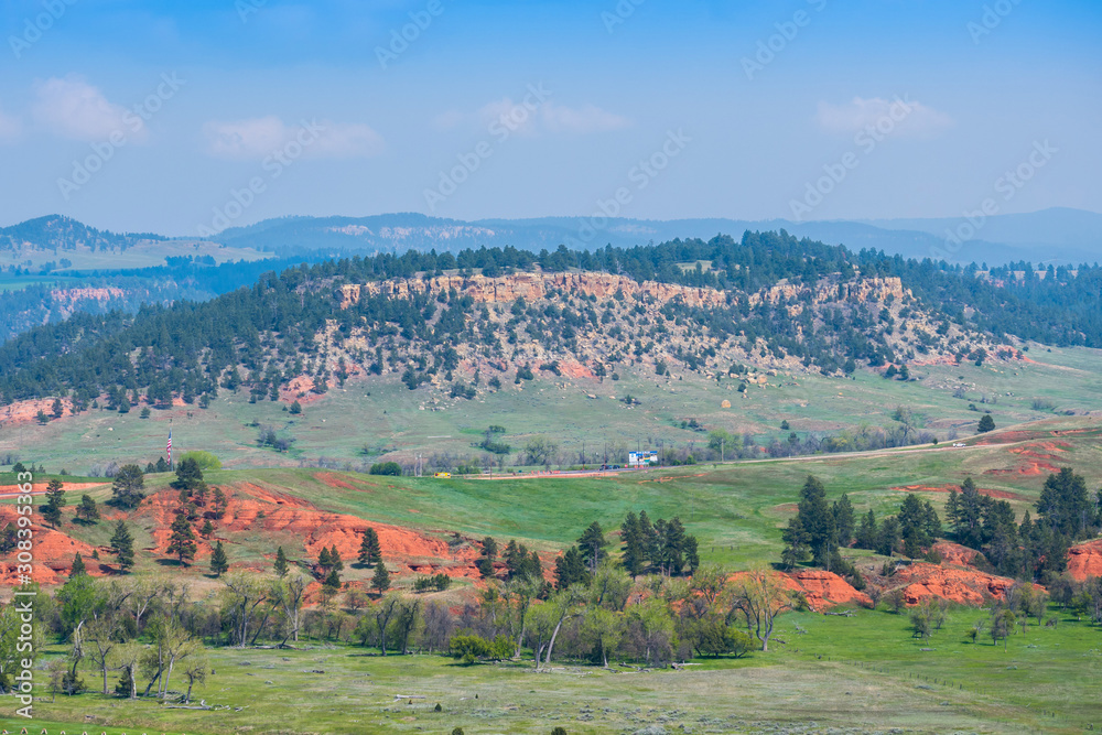 Naklejka premium A naturally formed red sandstone rocks in Devils Tower National Monument, Wyoming