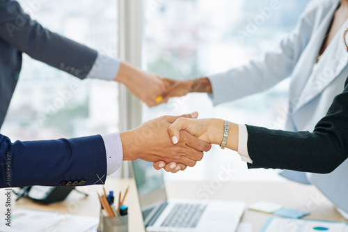 Wallpaper Mural Hands of business executives shaking hands after successful business meeting in office Torontodigital.ca