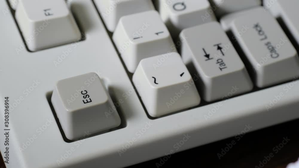 Finger many times presses ESC button on keyboard Finger many times presses ESC button on keyboard