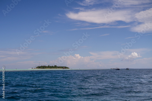 Dark blue and turquoise green with small island in Semporna, Borneo, Sabah.