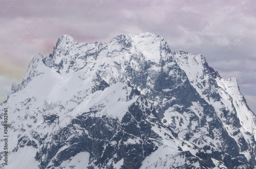 Mountain landscape with a beautiful peak in the rays of the setting sun Mountain landscape with a beautiful peak in the rays of the setting sun