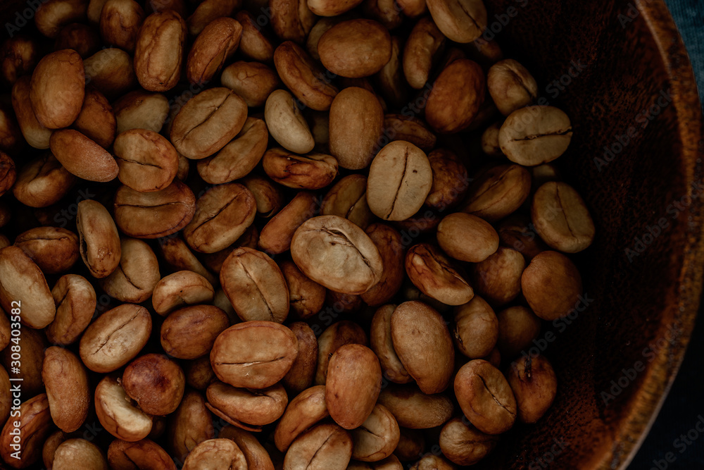 Selecting coffee beans thoroughly, picture on a black background