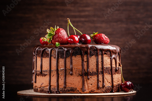 Fotobehang Chocolate cake with with berries, strawberries and cherries