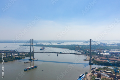 Wallpaper Mural Phu My Bridge on a sunny day with blue sky with shipping on the Saigon River in Ho Chi Minh City, Vietnam Torontodigital.ca