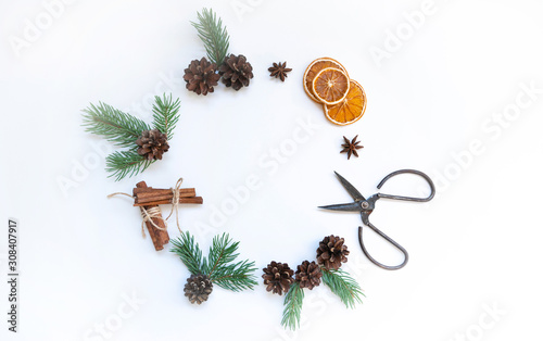 Christmas composition. Christmas wreath on light background. Flat lay, top view, copy space. Christmas round frame made of natural winter things. Flat lay.