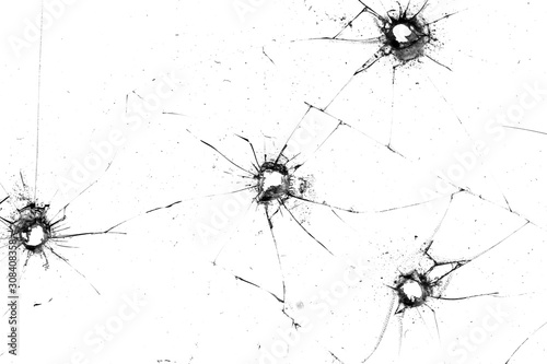Fotografie holes in the glass with cracks isolated ON WHITE
