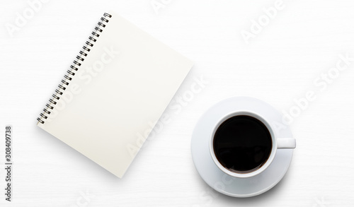 top view blank note book and coffee cup on white background