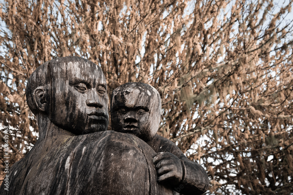 Wooden figures of parent and child