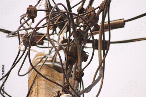 the wires are twisted on electric poles