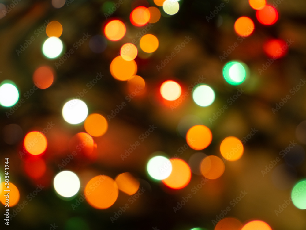 Obraz premium Christmas light background. Holiday glowing backdrop. Defocused Background. Blurred Bokeh.