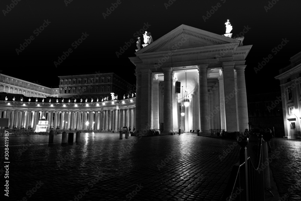 part of the colonnade of San Pietro, Rome at night