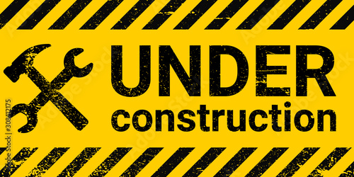 under construction site banner sign vector black and yellow diagonal stripes under construction, hammer and wrench repair sign with grunge texture