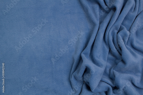 Fleece fabric blue top view. Texture of textile fleece bedspread. photo