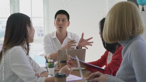 Group of young asian business team meeting in company