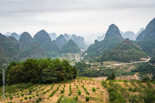 Принти на полотні Karts hill Mountains view, on a cloudy misty morning in South China