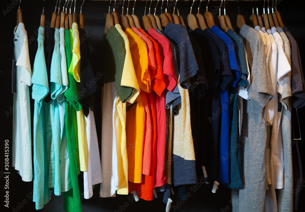 Variety of male wear on hangers and shelves