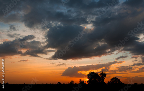 sunsey with beautiful colors and silhoueets in the foreground 