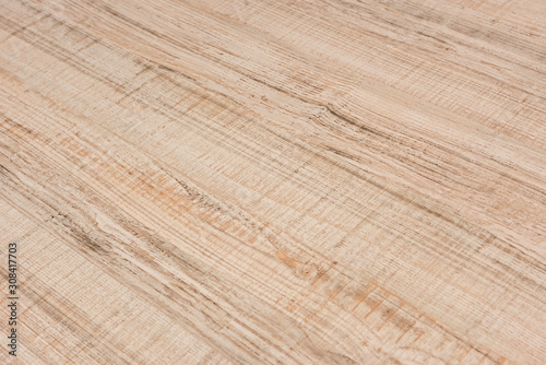 Textured wooden plank of light color as background