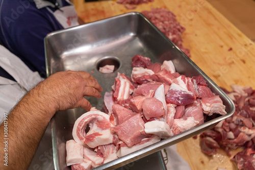 winter processing pork meat bacon cotechini zamponi and sausage photo