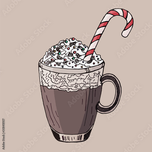 Cocoa with whipped cream and a candy cane. Christmas drink.