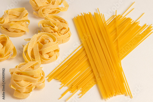 Durum wheat pasta on a white background. Organic food