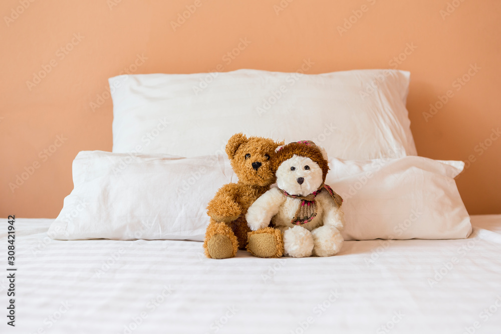 Cute couple brown and white teddy bear sitting together on the bed, bed time, love and romance concept