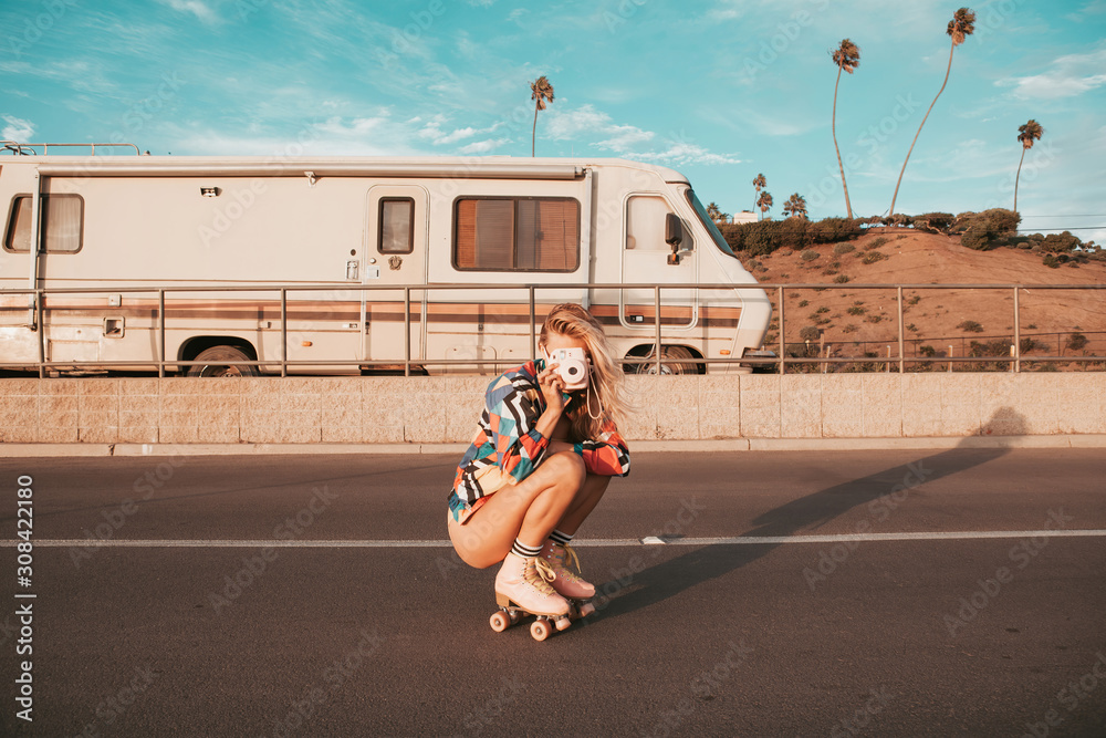Naklejka premium retro style skater girl with a camper van in the background. california lifestyle